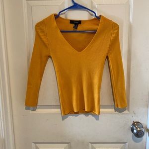 Yellow shirt, with deep v-neck with mid sleeve